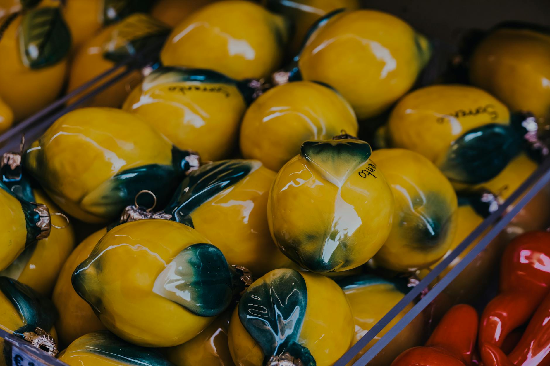Vibrant yellow ceramic lemons displayed artfully, symbolizing the innovative design of lemon clitoral vibrators